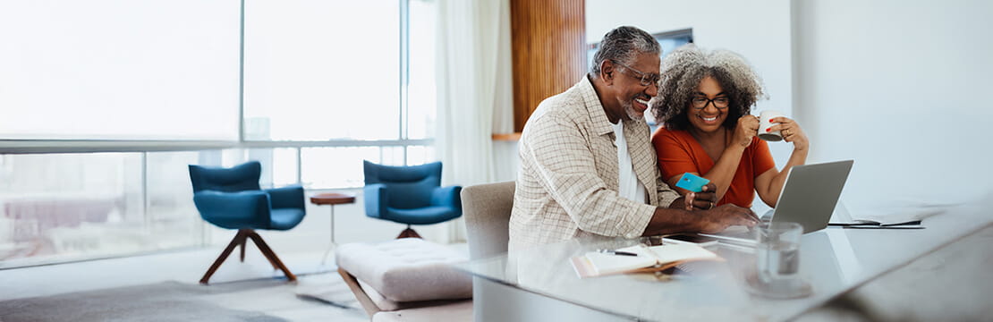 A couple looking at the laptop screen